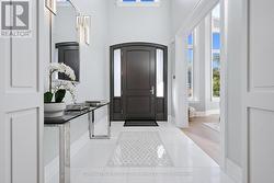 Impressive Foyer with a Remote-Lowering Chandelier -