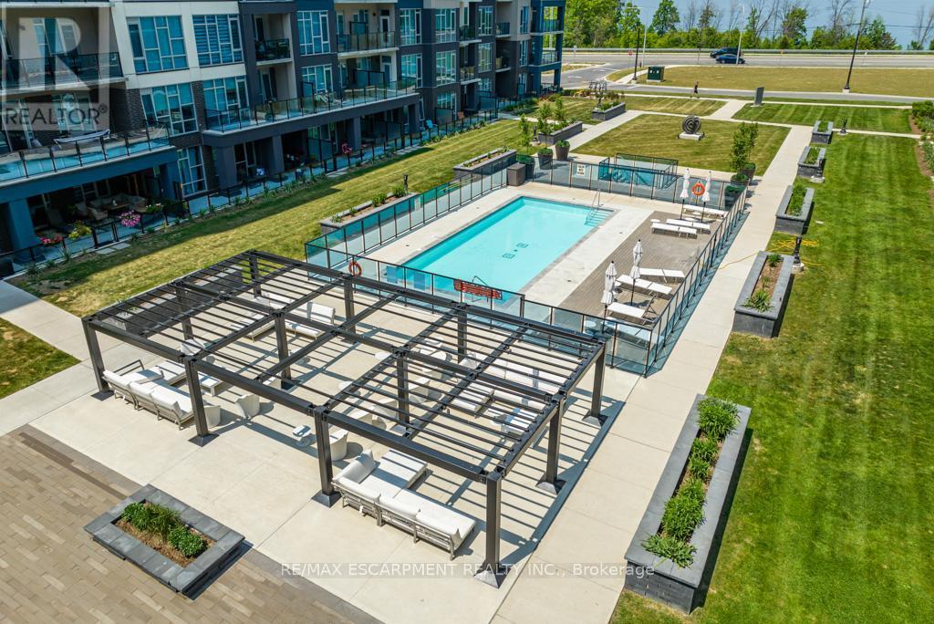 118 - 16 Concord Place, Grimsby, ON - Outdoor With In Ground Pool