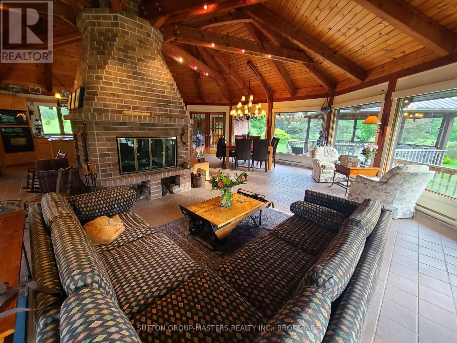 314 Baseline Road, Frontenac Islands (The Islands), ON - Photo Showing Living Room With Fireplace