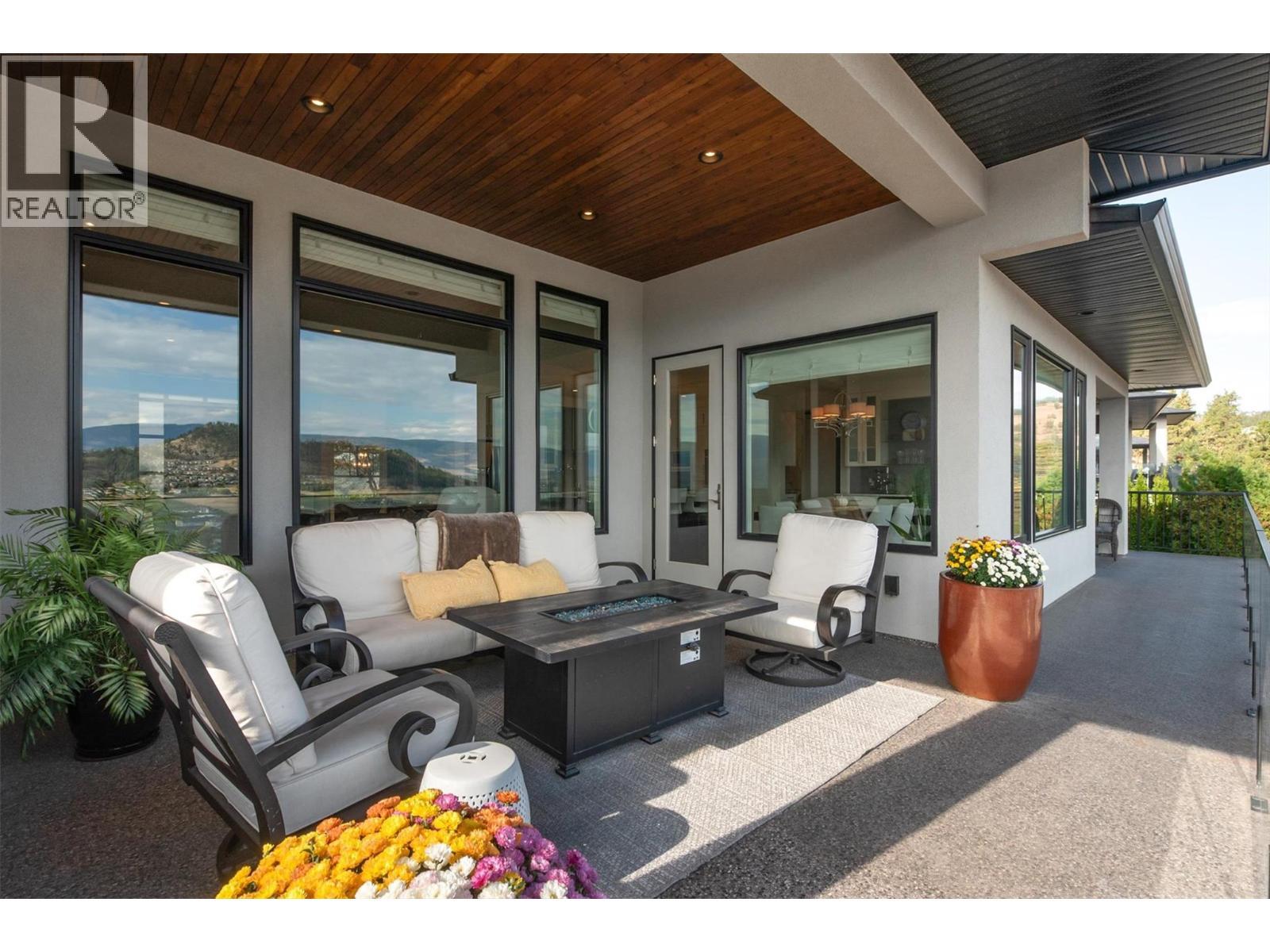 Enjoy the sunrise on your private covered living space - 738 Highpointe Drive, Kelowna, BC - Outdoor With Deck Patio Veranda With Exterior