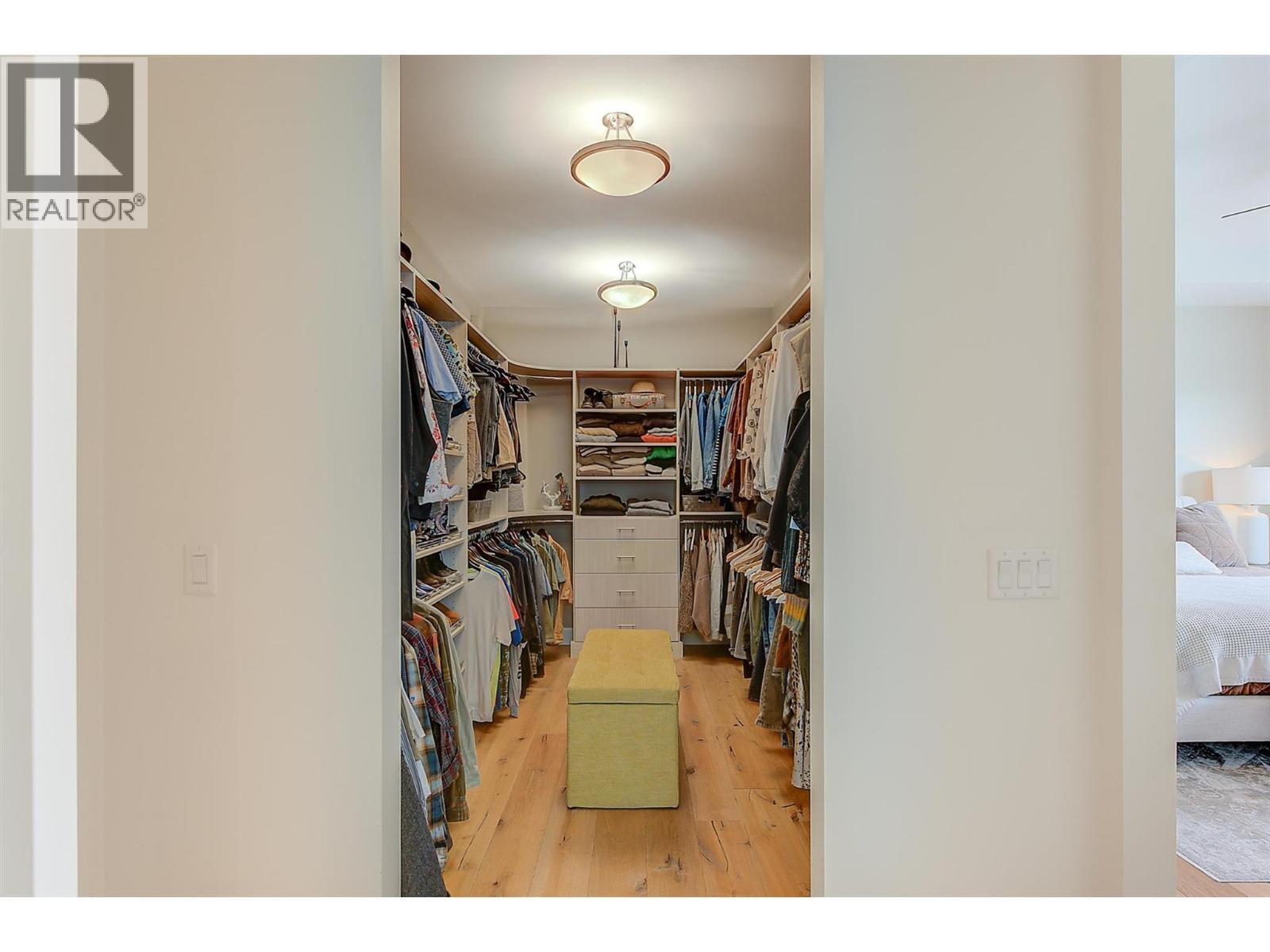 a spacious walk-in closet with built-ins - 738 Highpointe Drive, Kelowna, BC - Indoor Photo Showing Other Room