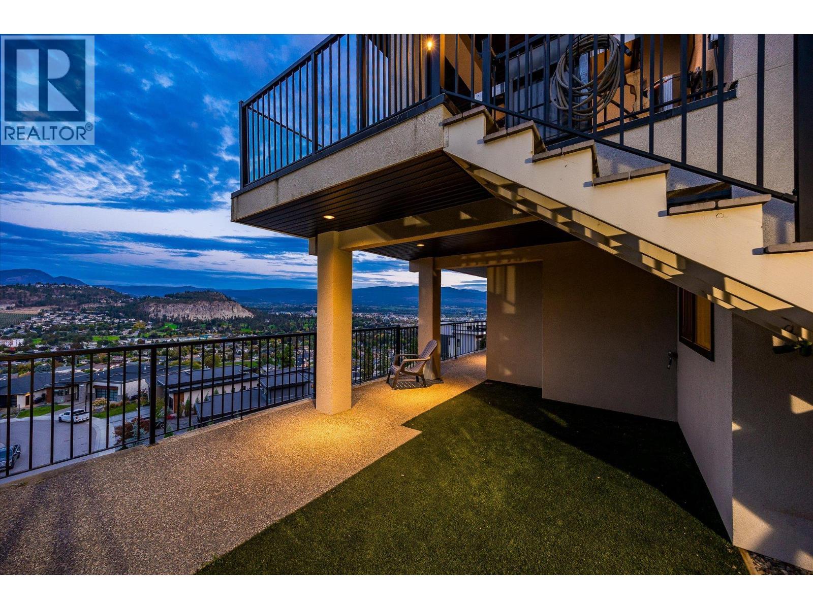 A separate fenced dog area with synthetic turf to protect your grass, - 738 Highpointe Drive, Kelowna, BC - Outdoor With Exterior