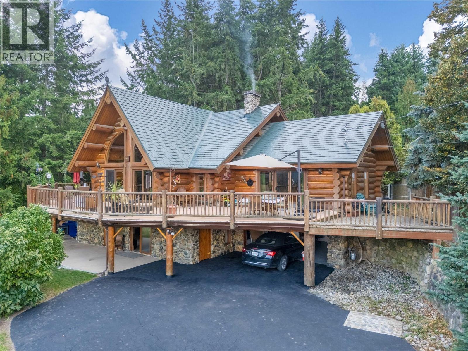 Custom build log home with double attached garage - 2462 Leisure Road, Blind Bay, BC - Outdoor With Deck Patio Veranda