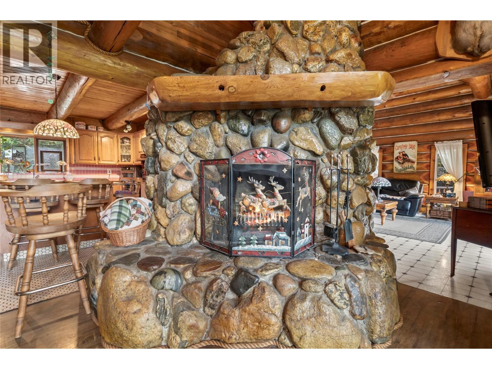 Rock fire place - 2462 Leisure Road, Blind Bay, BC - Indoor With Fireplace