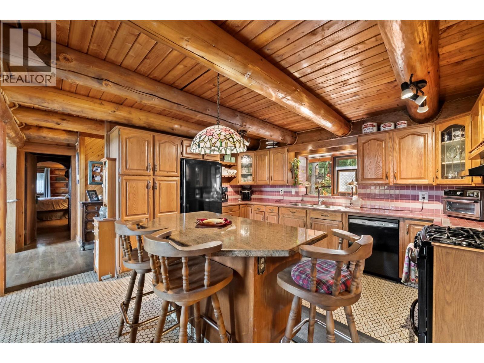 Kitchen with island - 2462 Leisure Road, Blind Bay, BC - Indoor Photo Showing Other Room