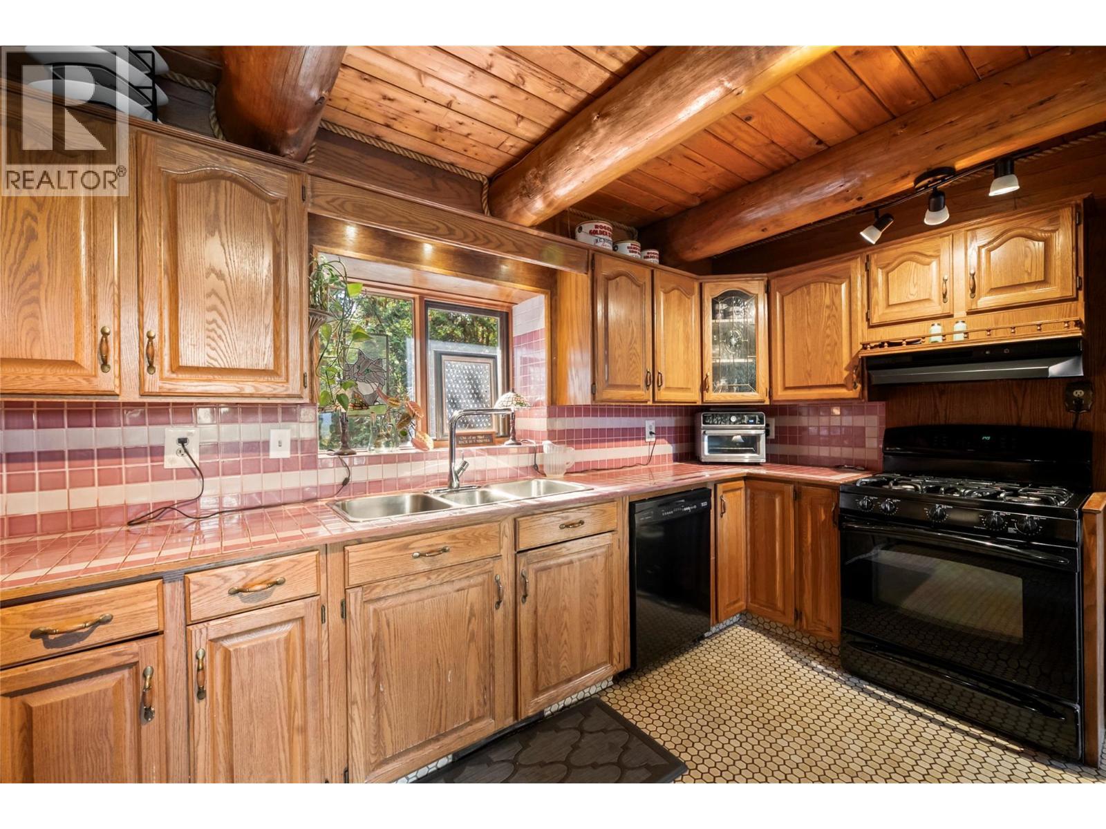 2462 Leisure Road, Blind Bay, BC - Indoor Photo Showing Kitchen With Double Sink