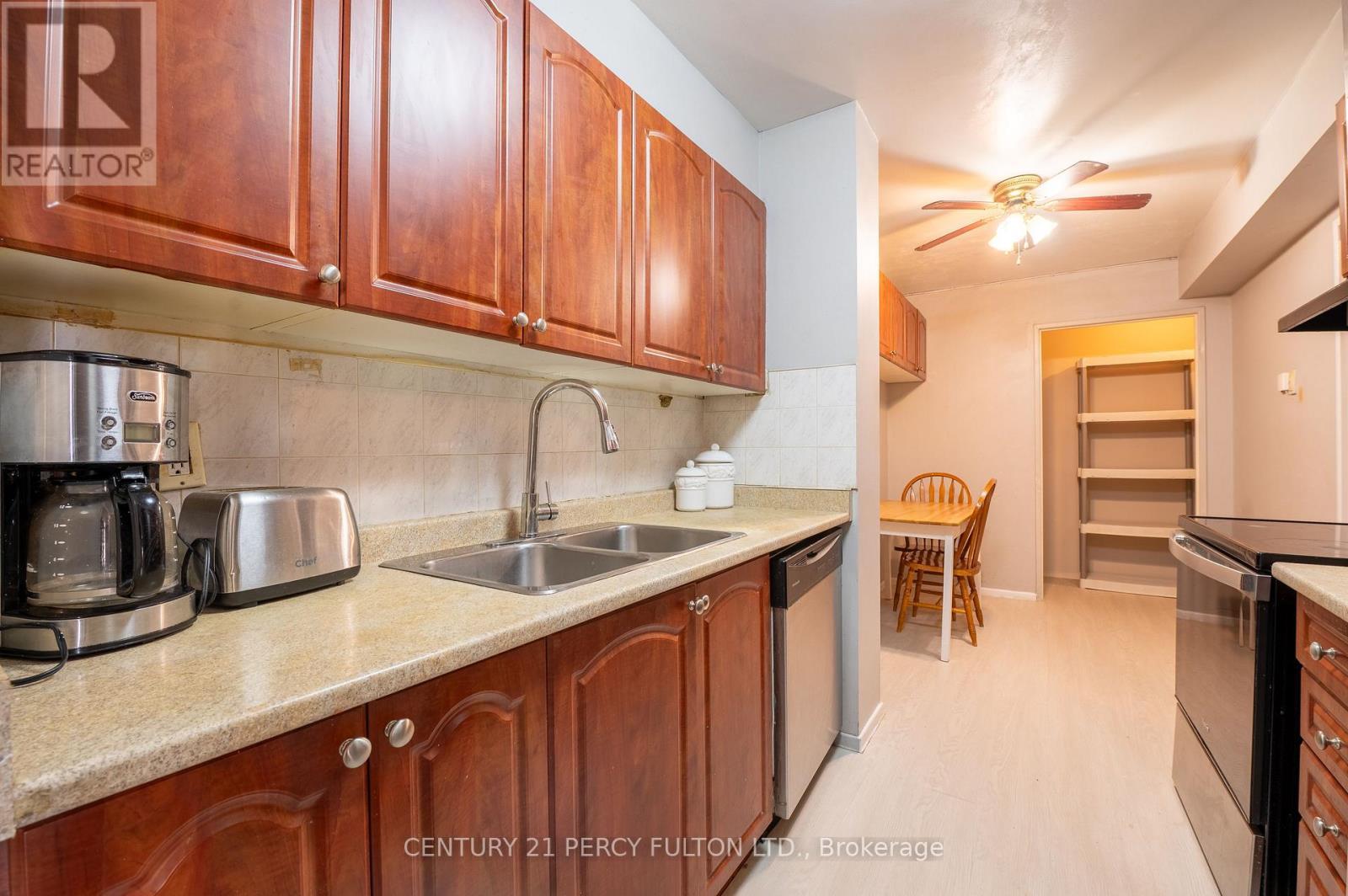 301 - 25 Silver Springs Boulevard, Toronto, ON - Indoor Photo Showing Kitchen With Double Sink