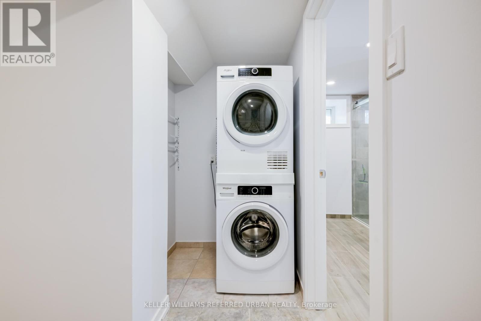 Lower - 2556 Lake Shore Boulevard W, Toronto, ON - Indoor Photo Showing Laundry Room