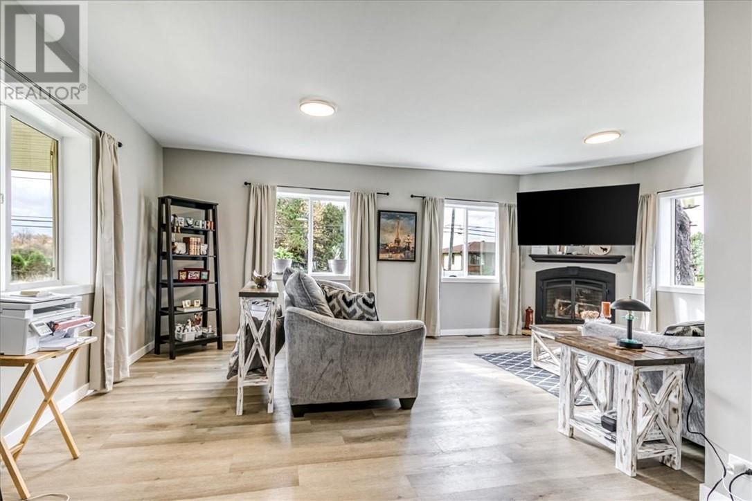 2906 Main Street, Blezard Valley, ON - Indoor Photo Showing Living Room With Fireplace