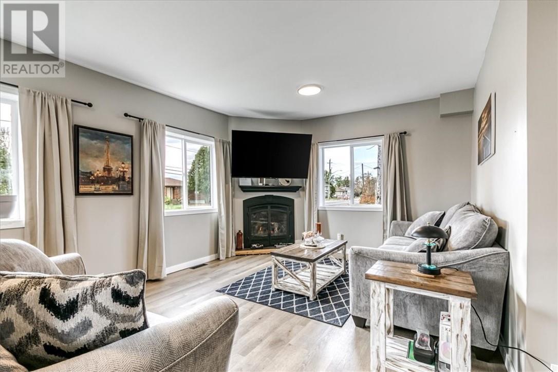 2906 Main Street, Blezard Valley, ON - Indoor Photo Showing Living Room With Fireplace