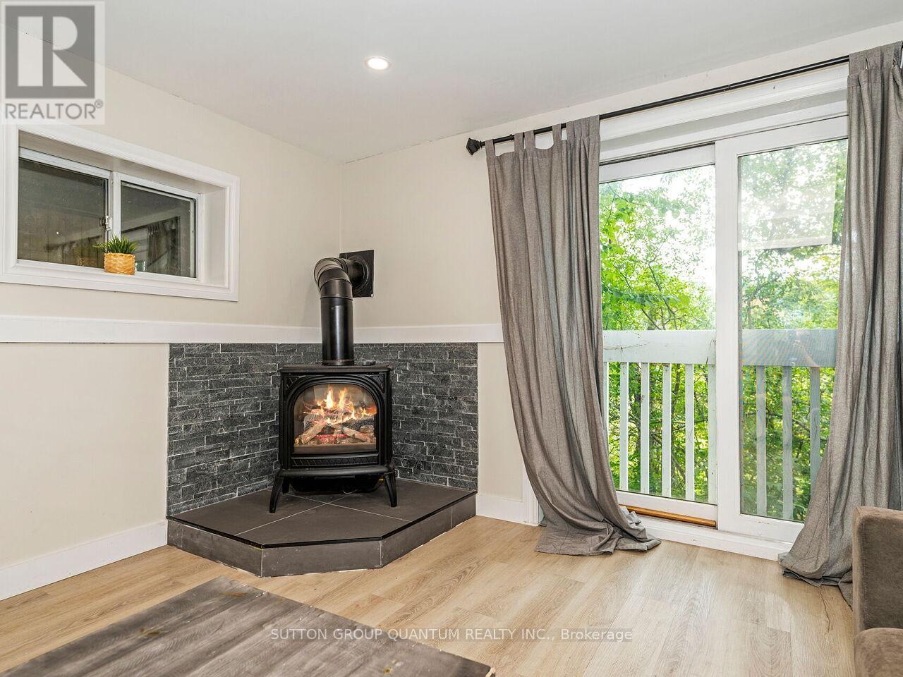 8 - 1006 Youngs Road, Muskoka Lakes, ON - Indoor Photo Showing Other Room With Fireplace