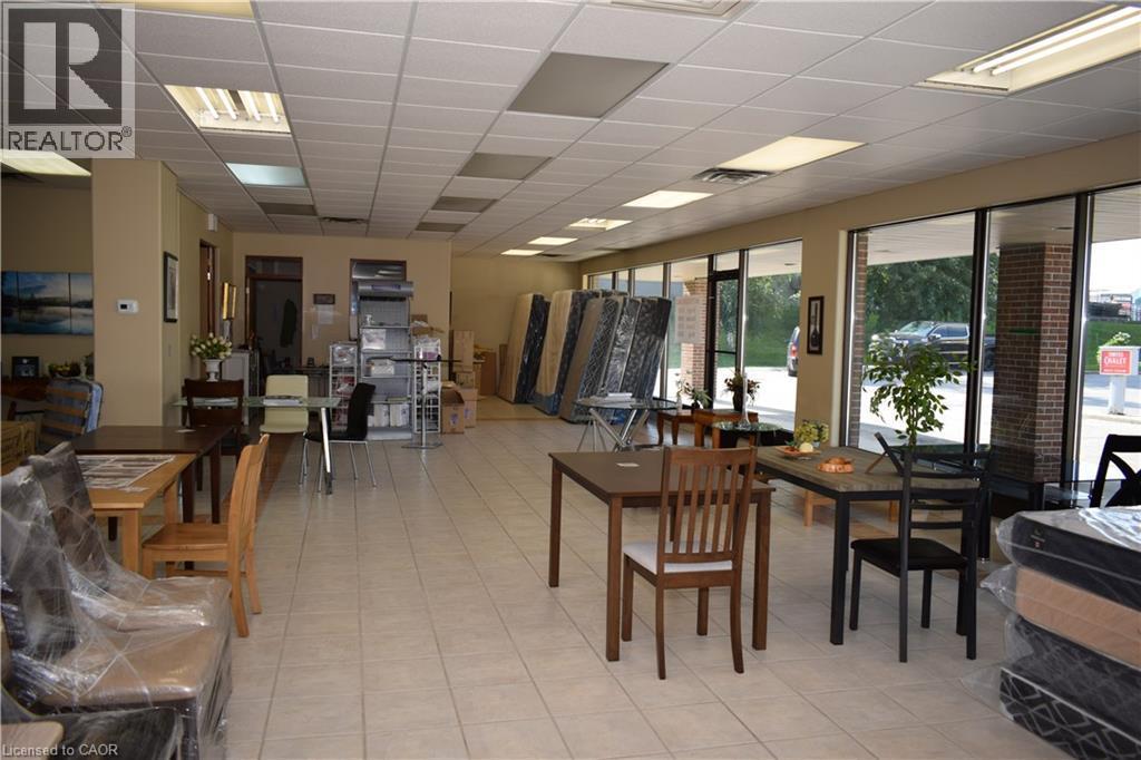 Dining room with a drop ceiling and light tile patterned floors - 1151 Victoria Street N Unit# 8, Kitchener, ON