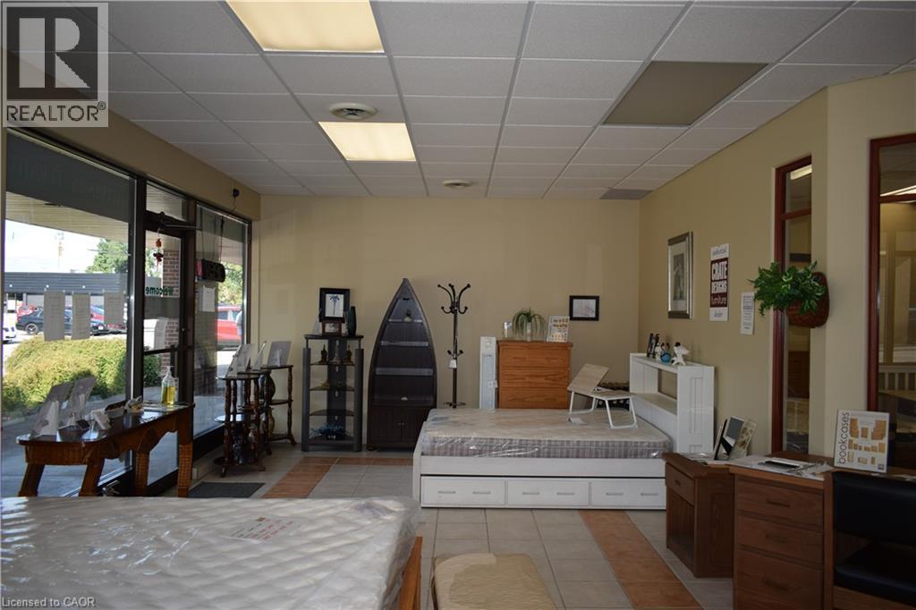 Bedroom featuring light tile patterned flooring and a drop ceiling - 1151 Victoria Street N Unit# 8, Kitchener, ON