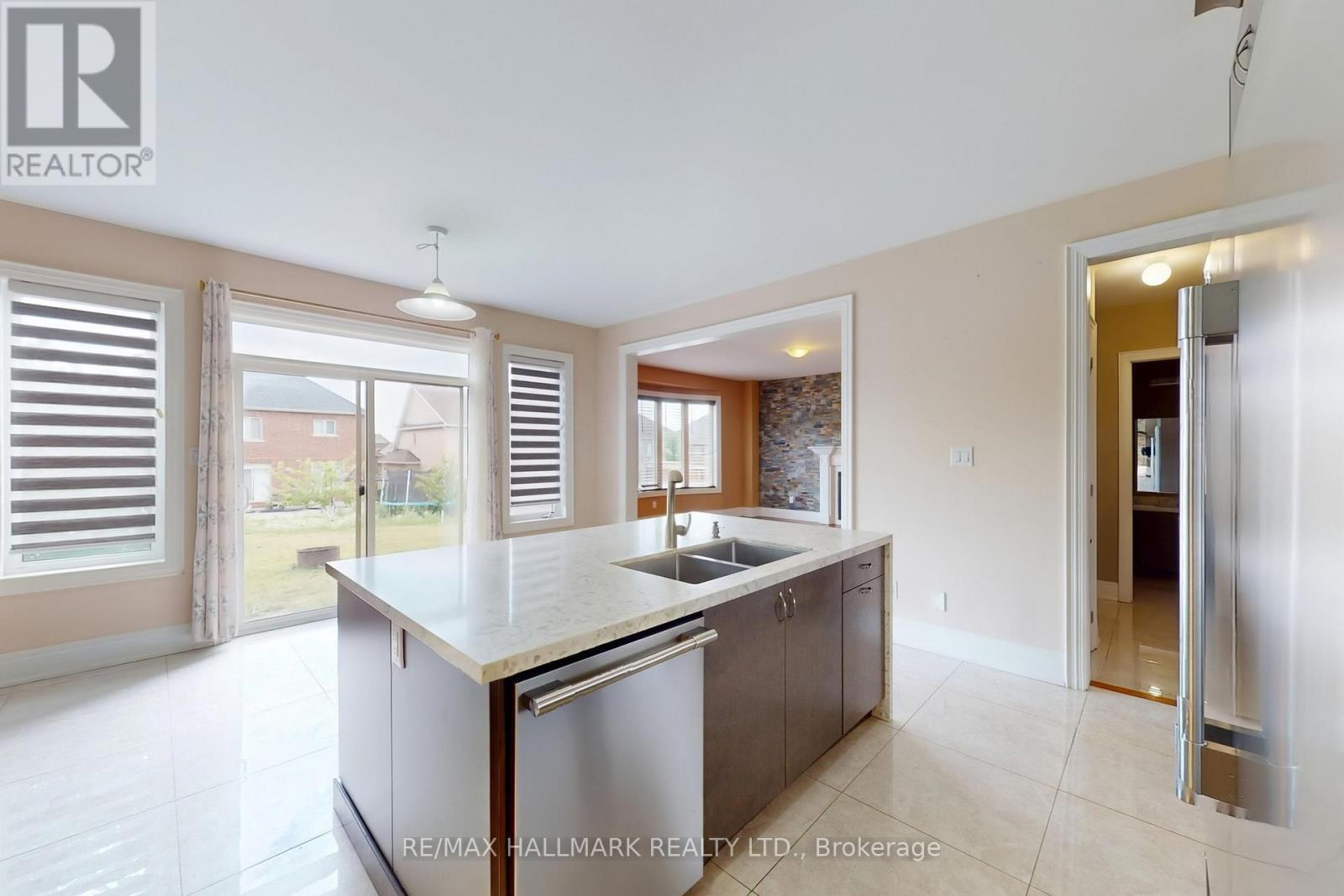 61 Mcisaac Drive, Springwater, ON - Indoor Photo Showing Kitchen With Double Sink