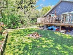 Fire pit lawn area with under deck extra storage -