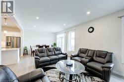 Living area featuring light wood-style floors and recessed lighting -