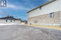 View of property exterior featuring brick siding -