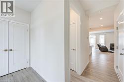 Hallway featuring light wood-style flooring and recessed lighting -