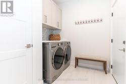 Laundry room with access to garage -