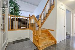 FOYER FROM GARAGE ENTRYTO UPPER LEVELS -
