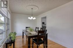DINING AREA WITH BAY WINDOWS -