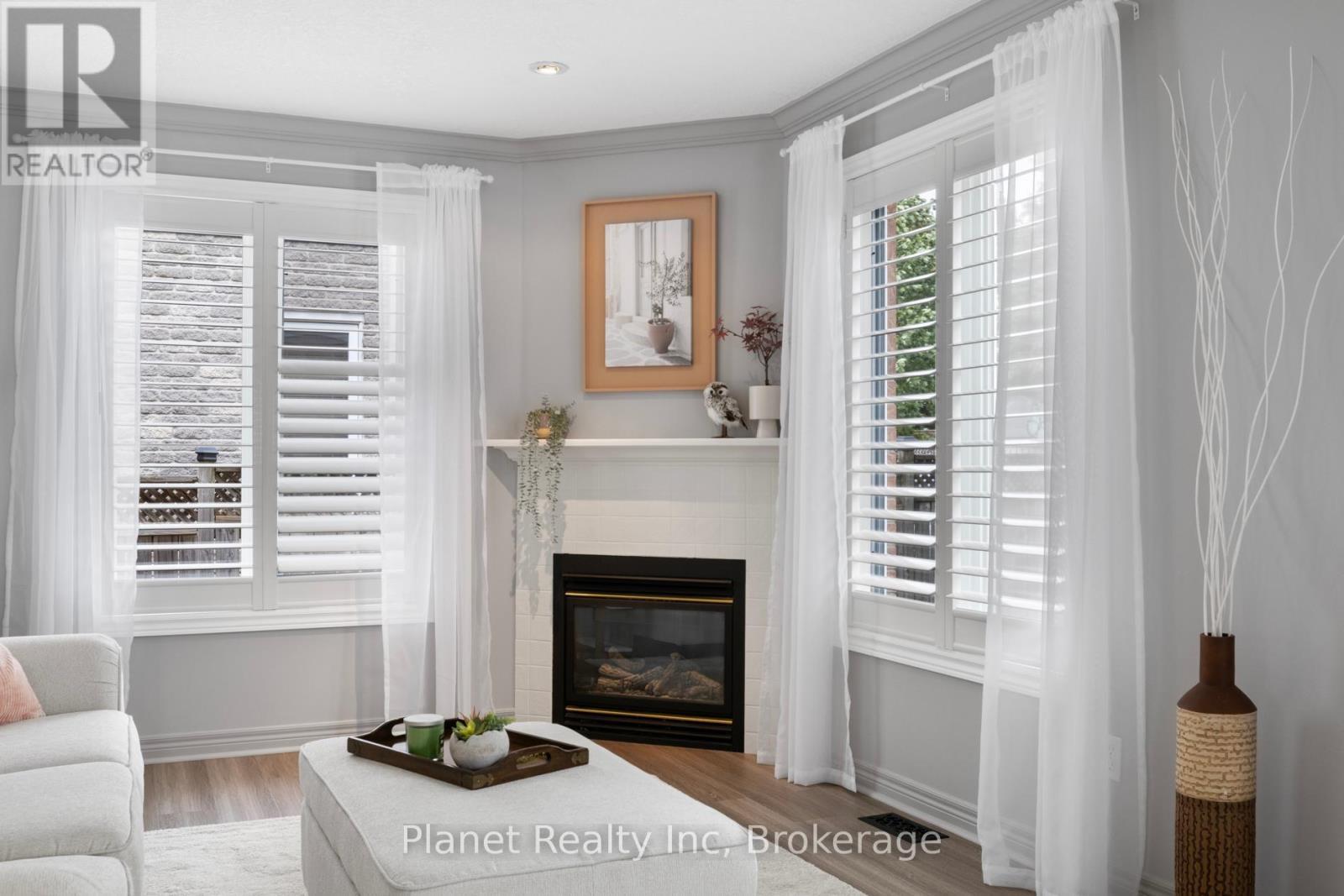 23 Muscovey Drive, Woolwich, ON - Indoor Photo Showing Living Room With Fireplace