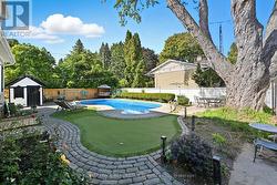 Private Backyard Features a Kidney-Shaped Pool -