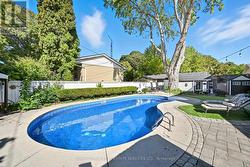 Private Backyard Features a Kidney-Shaped Pool -