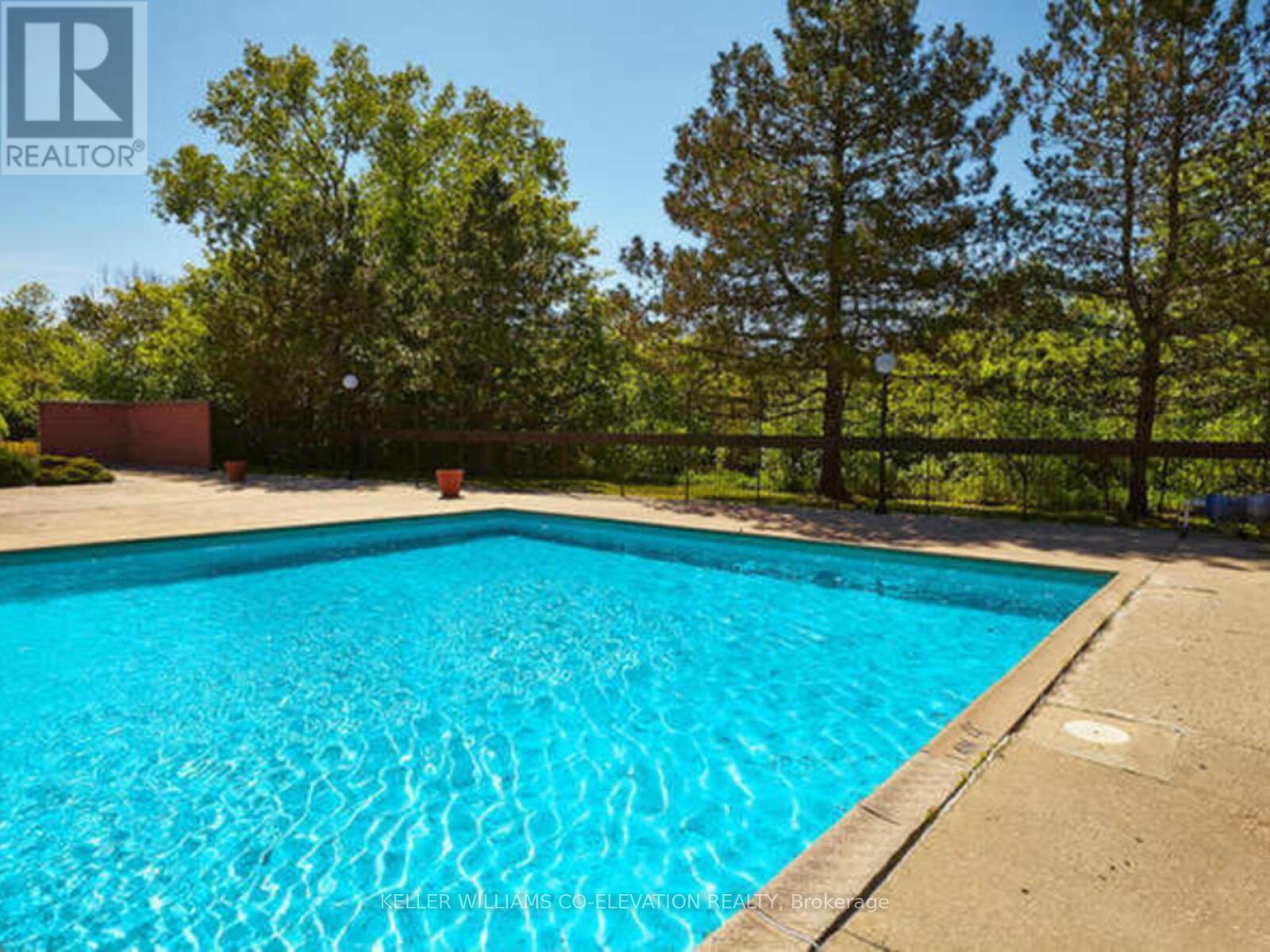 Outdoor Pool & Tanning Deck - 308 - 250 Scarlett Road, Toronto, ON - Outdoor With In Ground Pool With Backyard
