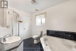 Second floor bathroom complete with soaker tub -