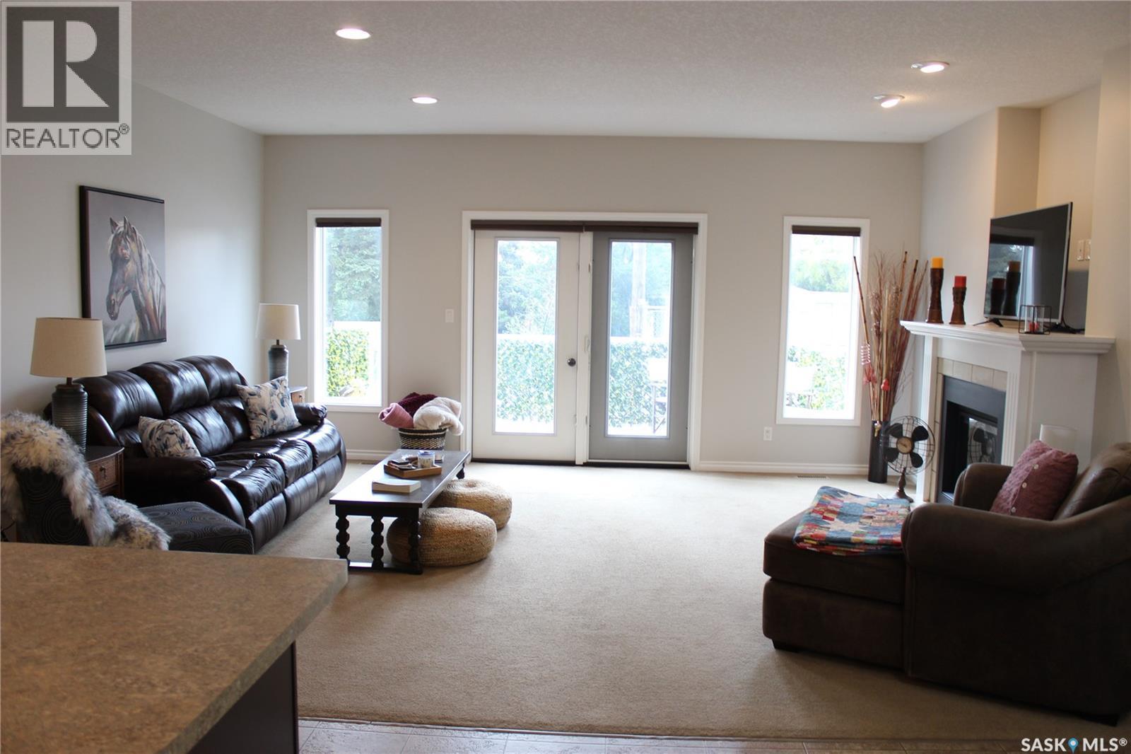 108 Erickson Street, Midale, SK - Indoor Photo Showing Living Room With Fireplace