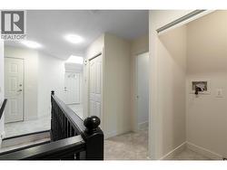 Closet in hall that has laundry hook ups -