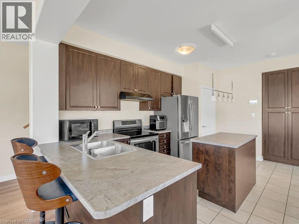 84 Rainbow Drive, Caledonia, ON - Indoor Photo Showing Kitchen With Stainless Steel Kitchen With Double Sink