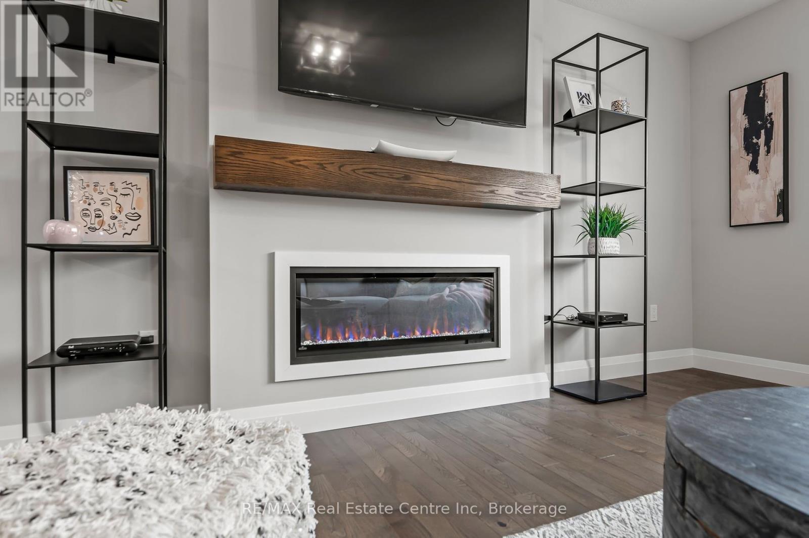 Photo is representation of Builders work - 218 Bridge Crescent, Minto, ON - Indoor Photo Showing Living Room With Fireplace