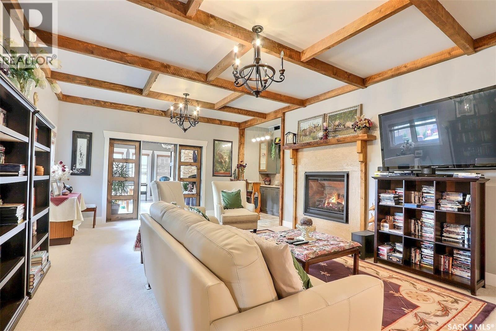 6111 Madden Place, Buckland Rm No. 491, SK - Indoor Photo Showing Living Room With Fireplace