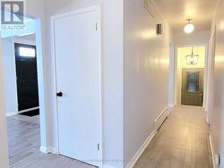 Main Floor Hallway Leads To Closed In Breezeway -