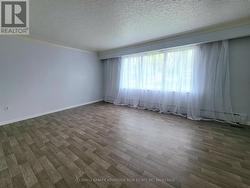 Living Room Large Window Allows In Natural Light -