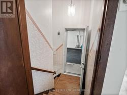 down to basement (door access to garage) -