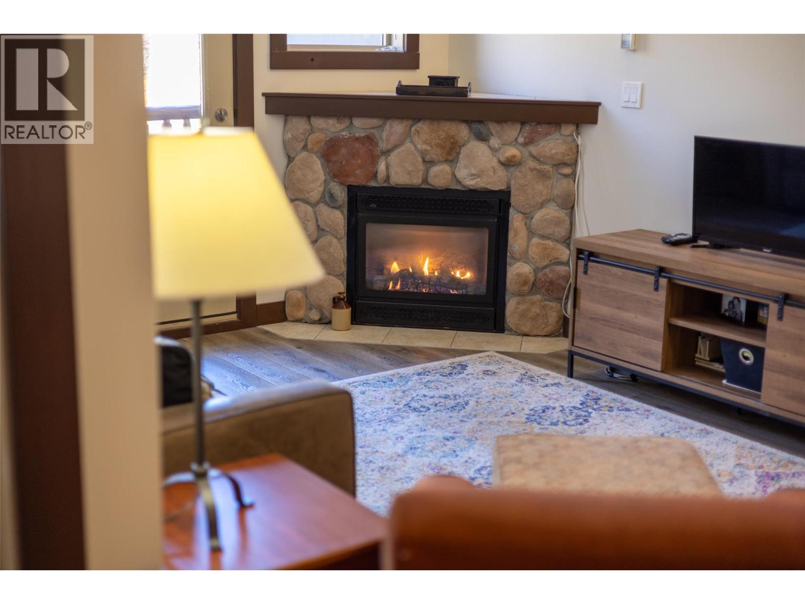 1500 Mcdonald Avenue Unit# 416, Fernie, BC - Indoor Photo Showing Living Room With Fireplace