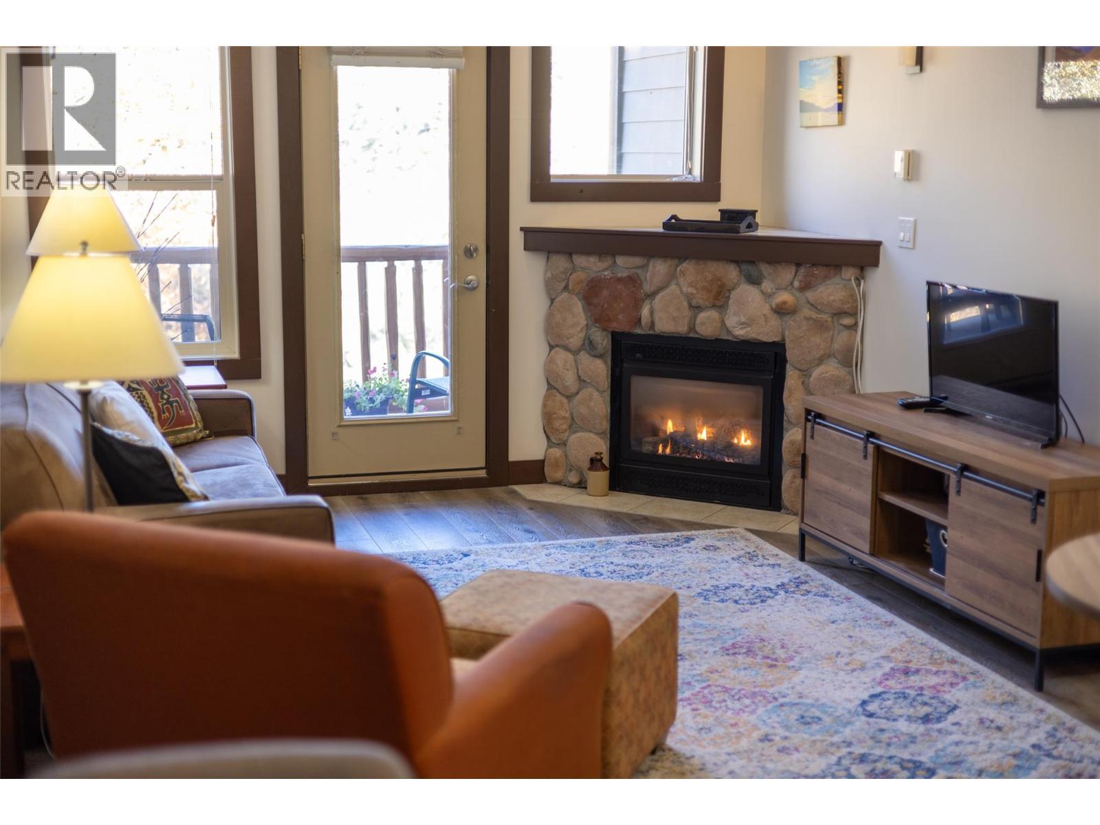 1500 Mcdonald Avenue Unit# 416, Fernie, BC - Indoor Photo Showing Living Room With Fireplace