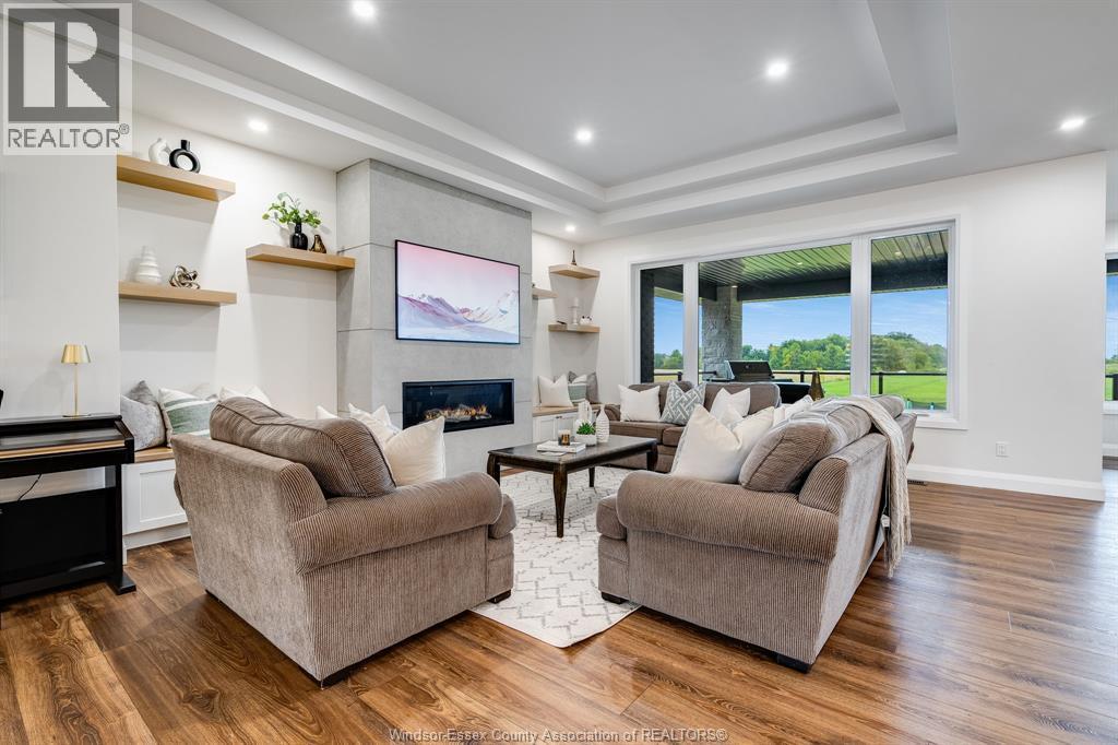 188 County Rd 27 East, Cottam, ON - Indoor Photo Showing Living Room With Fireplace