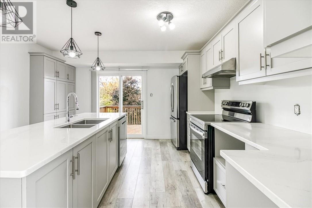 66 Meadowgreen Drive, Garson, ON - Indoor Photo Showing Kitchen With Double Sink With Upgraded Kitchen