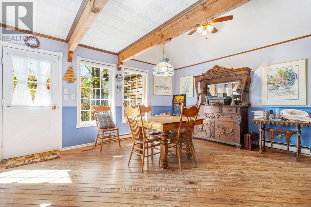 Walkout to Deck Overlooking the water - 74 Cottage Lane, Tweed (Elzevir (Twp)), ON - Indoor Photo Showing Dining Room