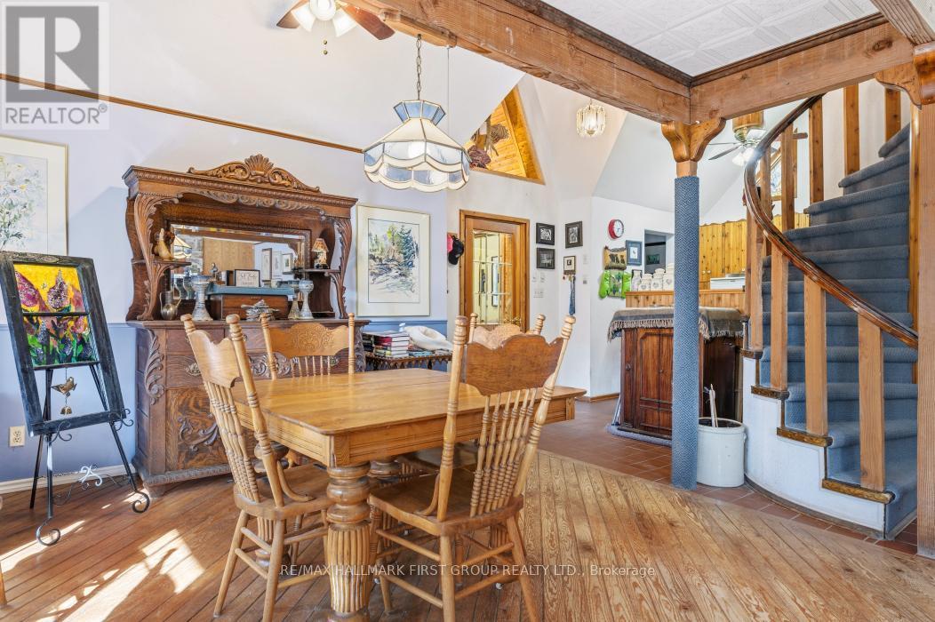 Custom Timber Beans & Spiral Staircase - 74 Cottage Lane, Tweed (Elzevir (Twp)), ON - Indoor Photo Showing Dining Room