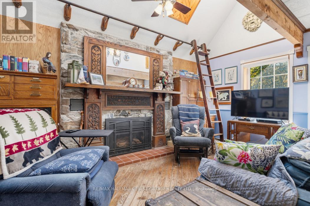 Cozy Living Room with Hardwood Floors - 74 Cottage Lane, Tweed (Elzevir (Twp)), ON - Indoor With Fireplace