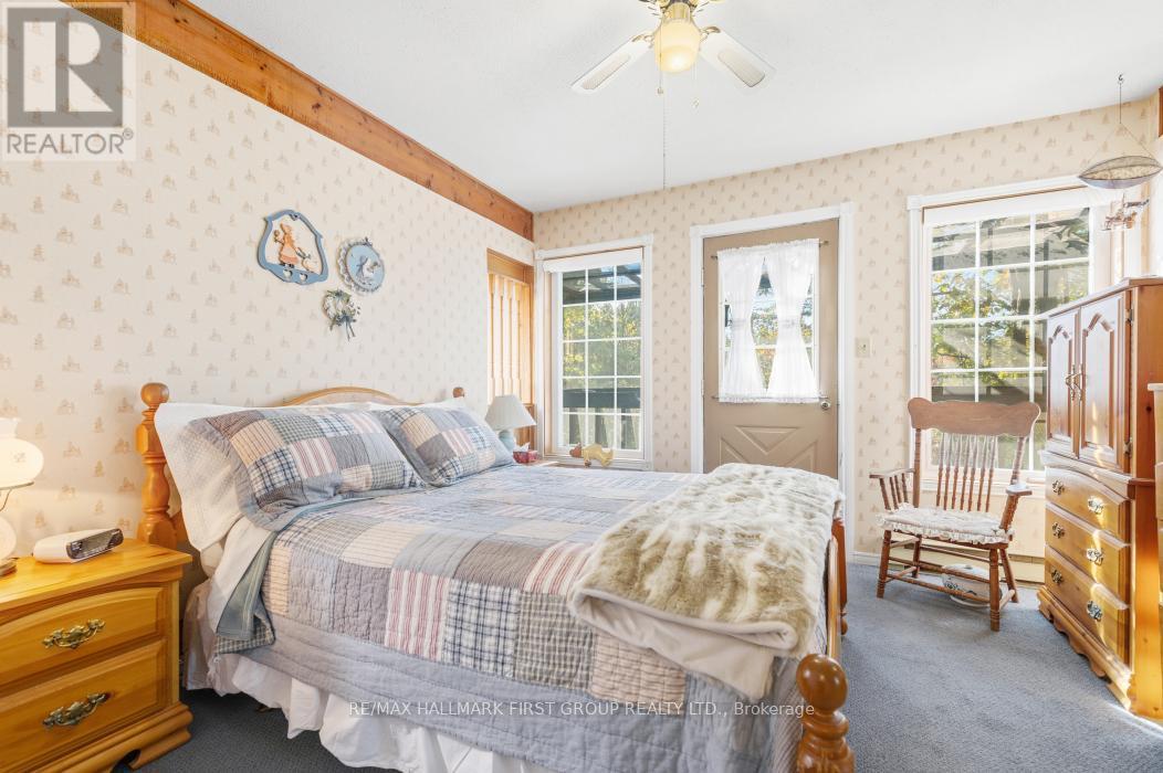 Bedroom 3 With Balcony Overlooking the Water - 74 Cottage Lane, Tweed (Elzevir (Twp)), ON - Indoor Photo Showing Bedroom