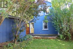 Back of house with deck to back porch and kitchen -