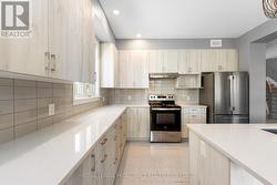Bright Kitchen with Quartz Counter Tops -