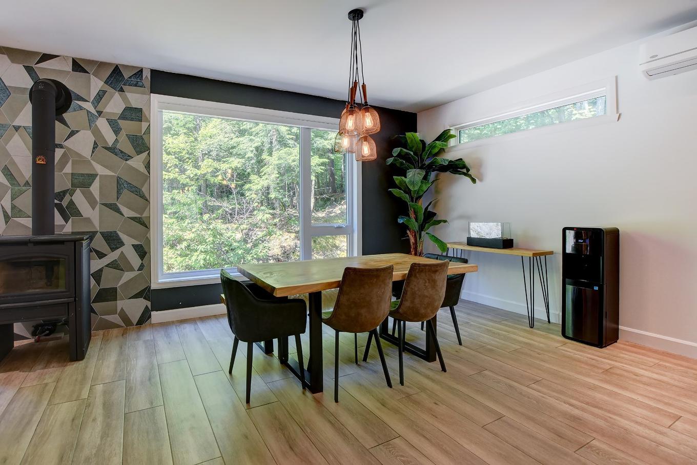 Dining room - 116 Rue Kavanagh, Saint-Colomban, QC - Indoor Photo Showing Dining Room With Fireplace