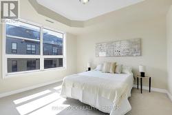 Primary bedroom with large windows -